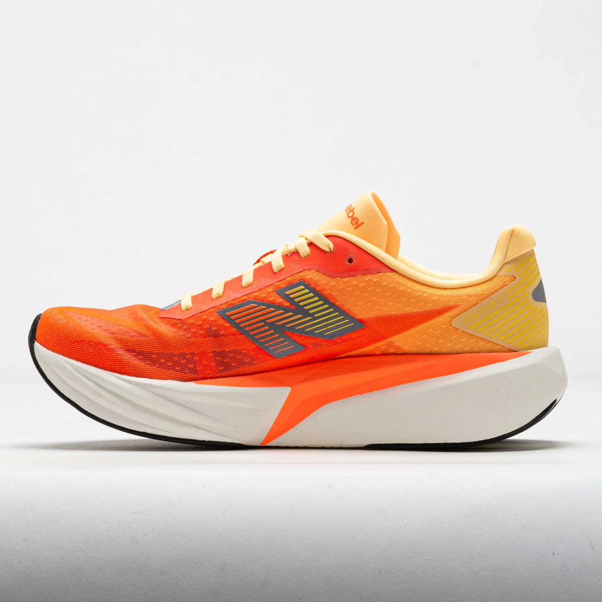 New Balance Men Rebel V5 - Tangerine Heat / Silver Metallic